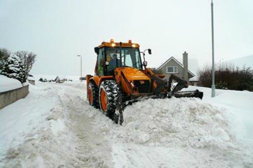 JCB ploughing snow
