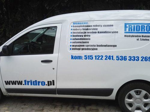 Side view of Dacia displaying company information