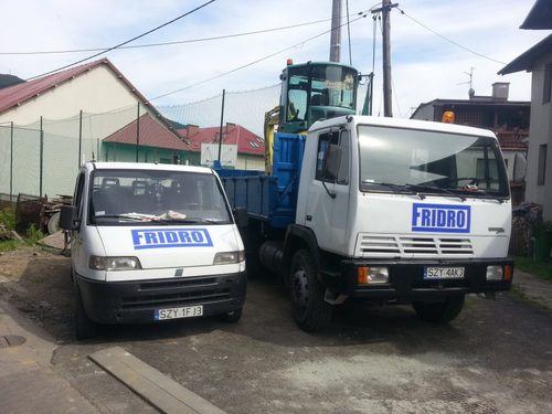 trucks parked at office displaying the fridro logo